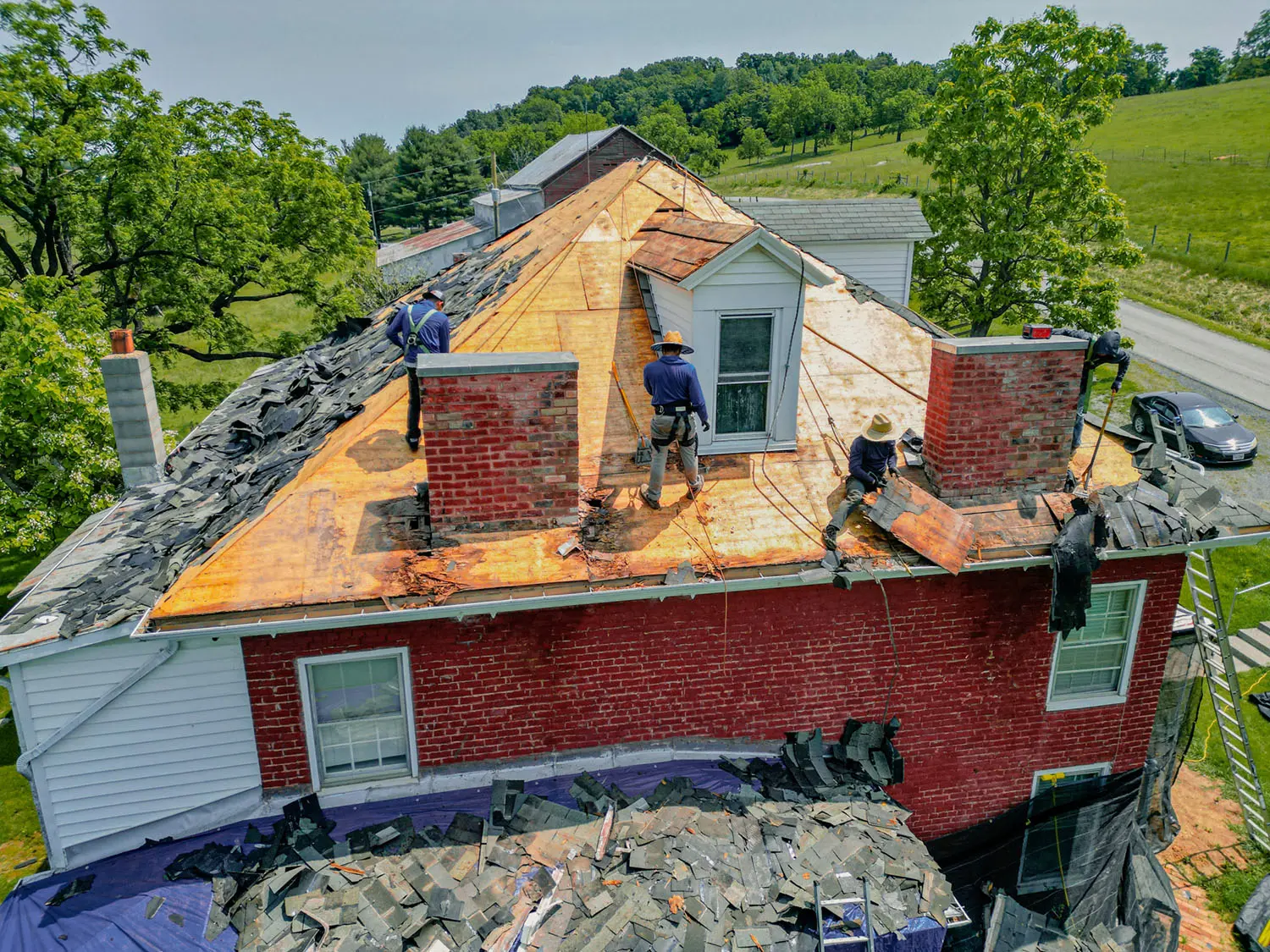 workers standing on roof
