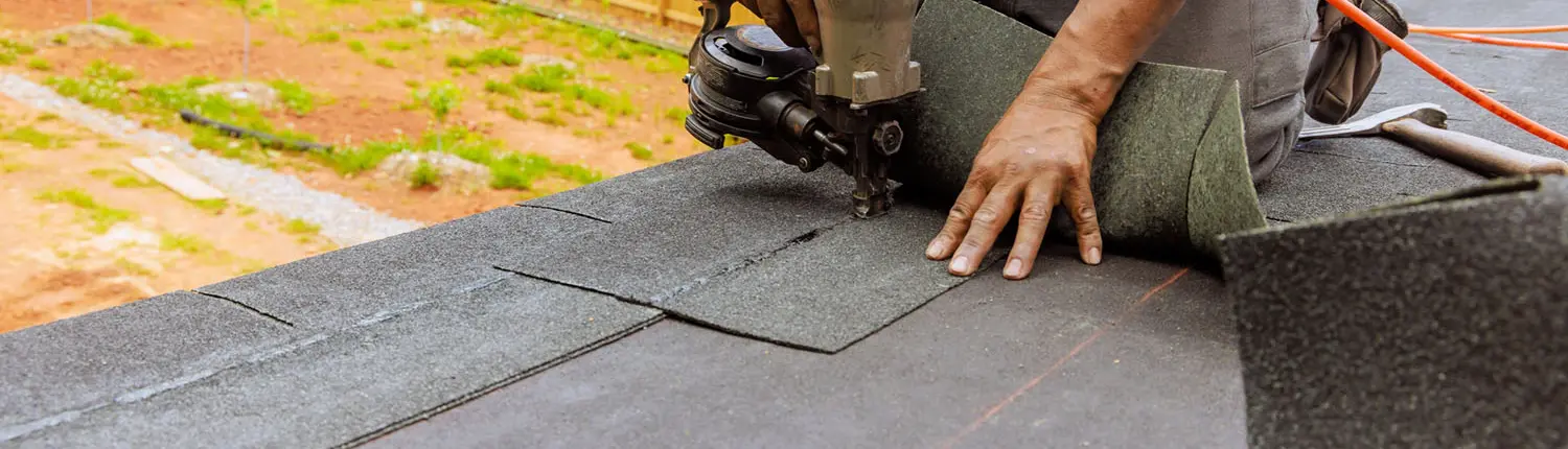 closeup of shingle being installed